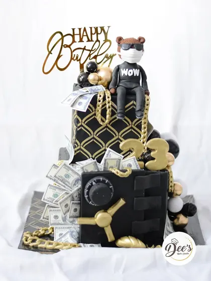 The full view of this extravagant money-themed cake, perfect for a 23rd birthday celebration.