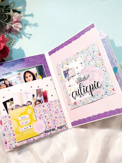 This page uses pockets to hold photos and notes, with a "this is all I need" tag.