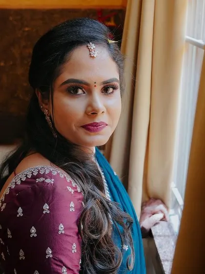 A quiet, contemplative portrait of the bride looking out a window. We use natural light to create soft, flattering portraits that feel timeless.