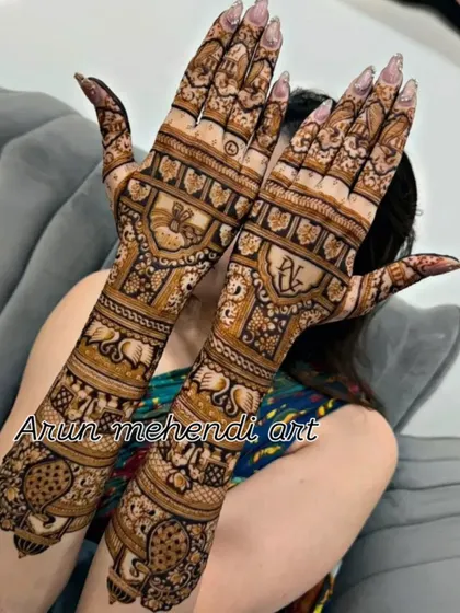 A stylish design with personalized initials and a variety of traditional animal motifs like elephants and camels.