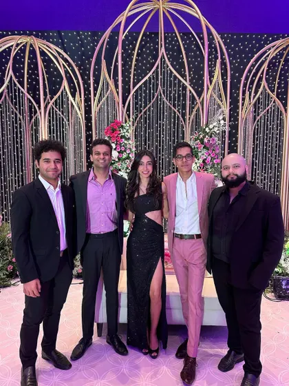 Posing with the band after a glamorous wedding reception. We are a team, on and off the stage.