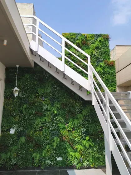 This installation in Punjabi Bagh, Delhi, shows how a green wall can transform a functional space like an outdoor staircase. The UV protective foliage ensures it stays green and vibrant for years.