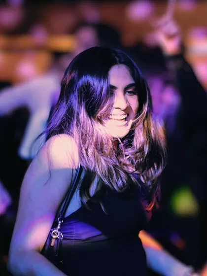 A happy guest enjoying the music at the Rare Rabbit party. My goal is to create a vibe where everyone feels comfortable hitting the dance floor and having a great time.