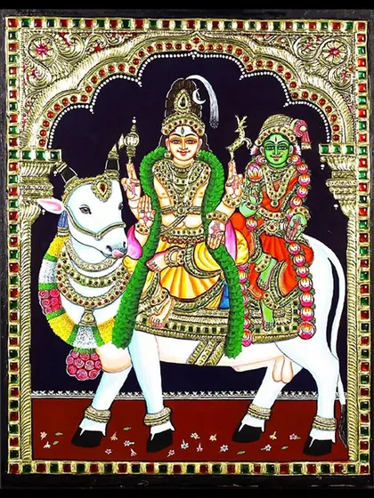 A divine Tanjore painting of Lord Shiva and Parvati riding on Nandi. This artwork symbolizes the harmonious journey of the divine couple, rendered with rich colors and intricate gold details.