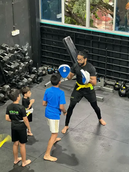 Always watching, always learning. Younger students learn so much by observing the older Kikkers and coaches during drills.