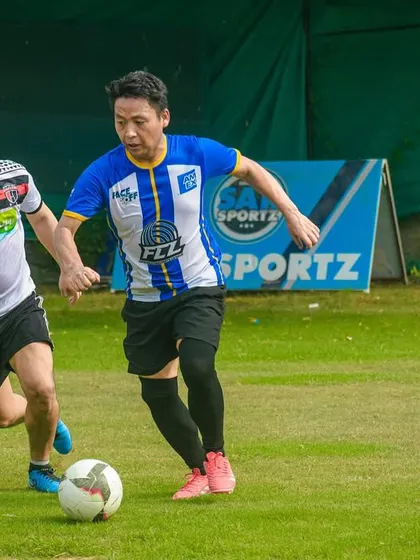 Two players battle for possession, showcasing the competitive but friendly spirit of the league.