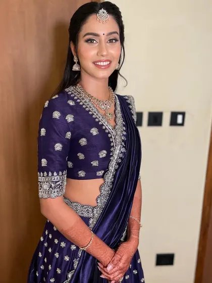 A full-length view of the reception outfit, showing how the makeup and styling create a cohesive and stunning appearance.