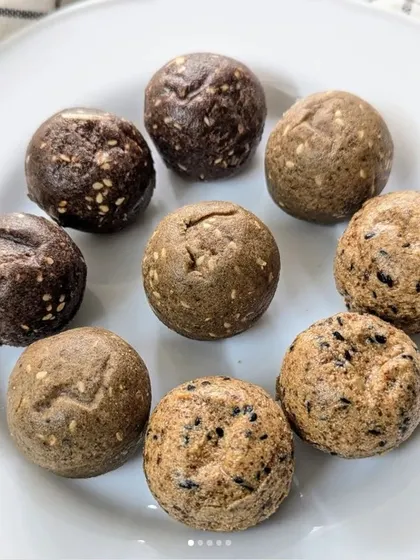 A beautiful assortment of my Millet Laddus, featuring Ragi, Jowar, and Bajra. These aren't just delicious, they are packed with nutrition from whole ingredients, nuts, and seeds. They are a perfect healthy snack that even kids love, tasting just like they were made at home, because they are.