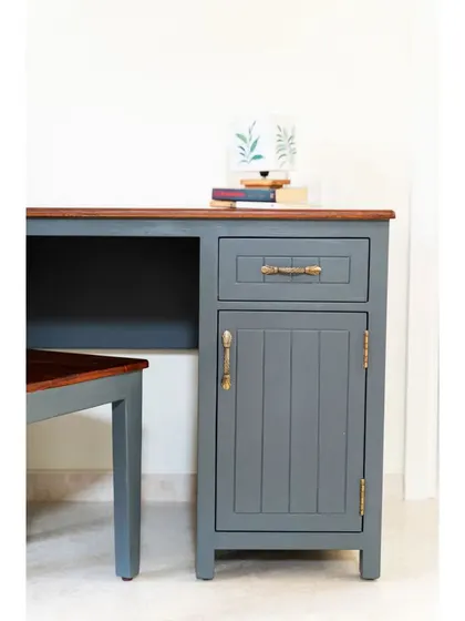 The storage cabinet of the study desk, featuring a drawer and a shuttered compartment.