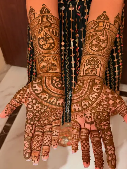 A special request for a bridal design with a cute panda. This full coverage mehendi combines traditional motifs like elephants and palaces with a personal touch.