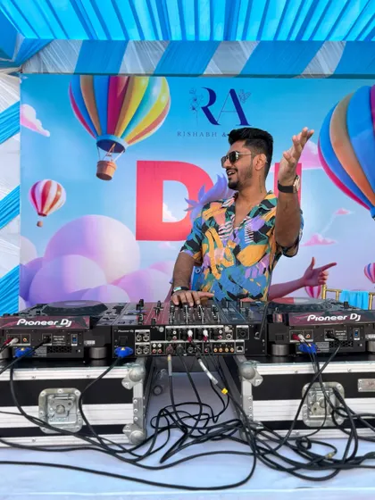 Getting the party started at a daytime pool party for a wedding. The fun, colorful backdrop set the perfect tone for a sun-soaked celebration.