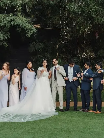The complete wedding squad! We love capturing these fun, energetic photos of the bride, groom, and their closest friends, celebrating the moment together.