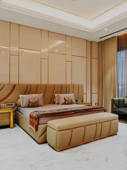 In this bedroom, we combined soft textures with clean, geometric wall paneling to create a sanctuary that is both modern and deeply comfortable. The design ensures a feeling of rest and elegance.
