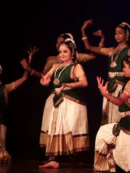 A group of dancers performing in perfect unison.