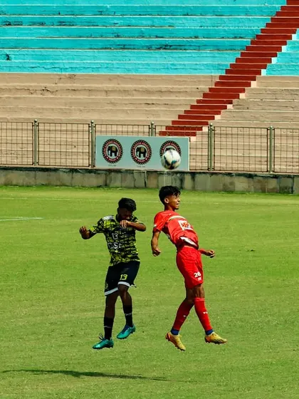 An intense aerial battle during a Delhi Premier League match. Our players are trained to be physically strong and brave in challenges.
