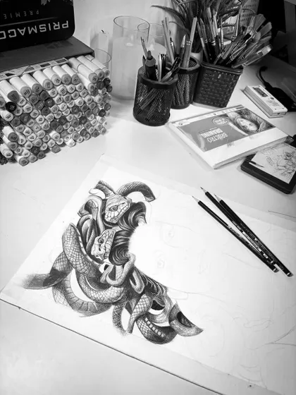 A work-in-progress shot of the Medusa piece. Here, you can see the hair, made of intricately drawn snakes, is partially complete, showcasing the complexity of the illustration from the start.