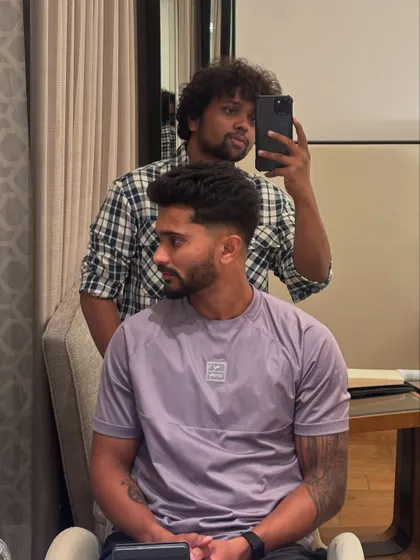 A side profile of Nitish Kumar Reddy's haircut, highlighting the clean fade and textured styling.