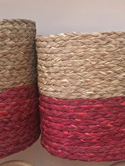 Our woven baskets are available in two-tone color-dipped designs, like this natural and red combination. They can be used as stylish planters, storage bins, or even as large tote bags.