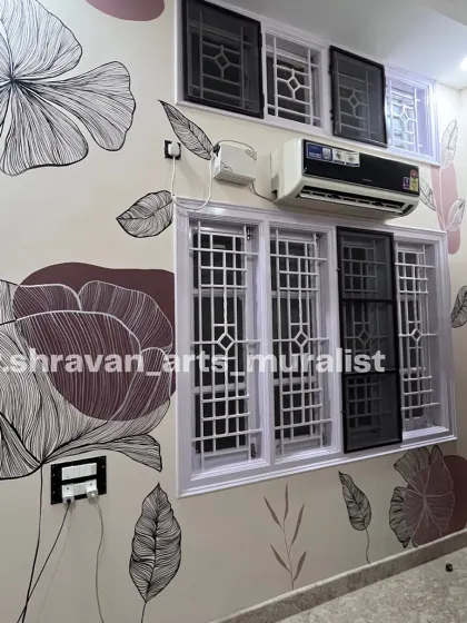 A bohemian foliage mural that plays with windows and other architectural features. The delicate line art and muted color palette create a calm and sophisticated design.