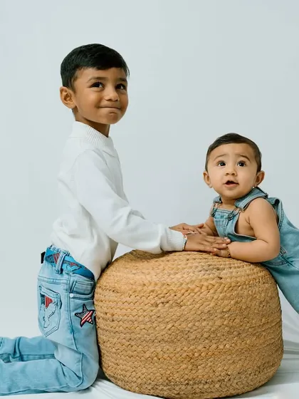 Brothers and best friends. This studio portrait captures the sweet and sometimes mischievous dynamic between siblings.