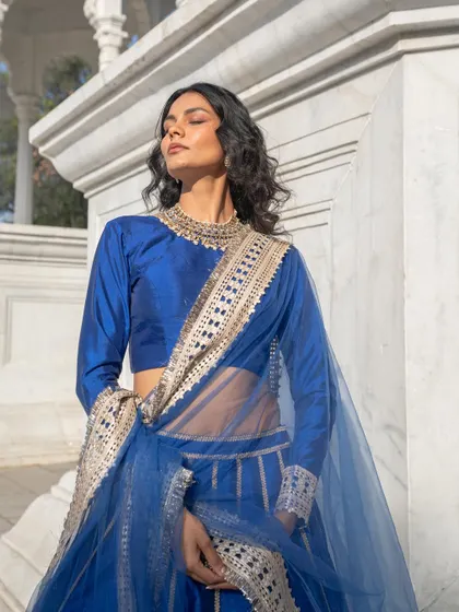 We are loving the costumes on the new Netflix shows. This beautiful royal blue silk lehenga has a similar high-quality, regal feel.