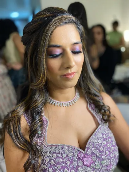 A detailed shot of the makeup with eyes closed, showcasing the flawless eyeshadow blending.