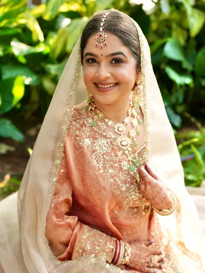 Another beautiful portrait in the garden. Her makeup looks fresh and timeless, a perfect look for a daytime wedding ceremony.