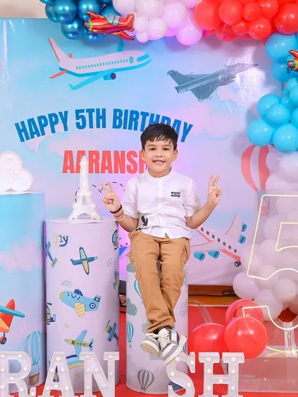 A vibrant 'Paw Patrol' themed birthday party, with character cutouts, a custom backdrop of Adventure Bay, and red and blue balloons, ready for a rescue mission.