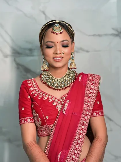 A close-up of this bride's serene and glowing makeup. The soft eyeshadow and perfectly blended base enhance her natural beauty without overpowering it.
