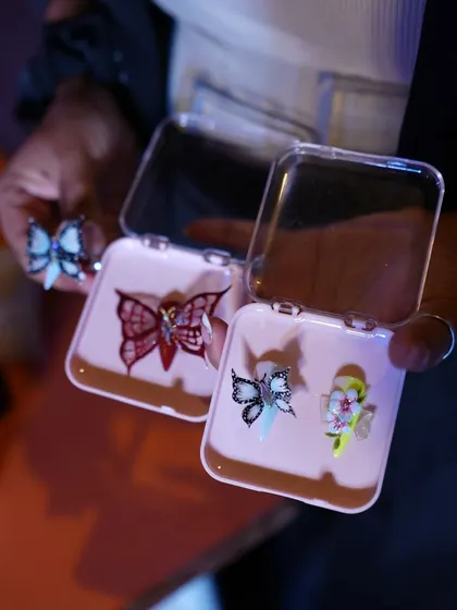 Sharing my creations on stage. Here I am showcasing some of my intricate 3D butterfly designs during a live demo at the Kolkata Nail Competition.