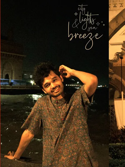 A happy moment by the sea at night, with the city lights and sea breeze as the perfect companions.