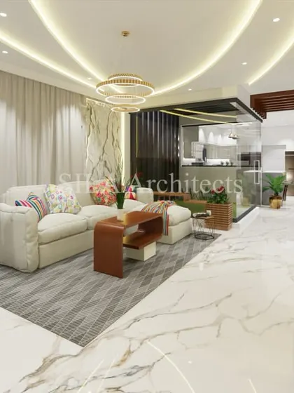 A complete view of the luxurious living space, showing how we use different textures, lighting, and furniture to define areas within an open-concept floor plan while maintaining a harmonious flow.