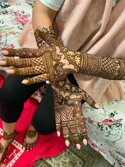 A beautiful shot of a client's full bridal mehndi, including matching designs on her feet. I am happy to travel to your home for a free trial to show you my quality.