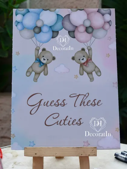 A "Guess These Cuties" game, where guests have to guess who's who from baby photos.