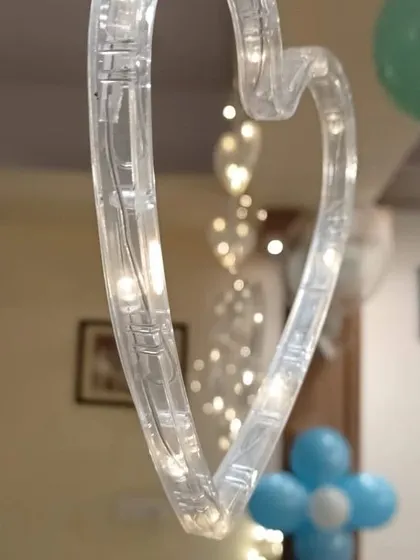 We use a variety of lighting elements in our decorations, including these beautiful heart-shaped string lights, to add warmth and ambiance.