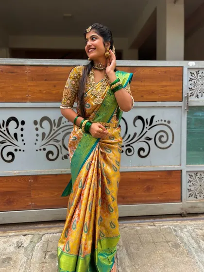 The way the light catches the silk and the vibrant colors of this saree is just beautiful. This is a testament to the quality of our handpicked wedding collection.