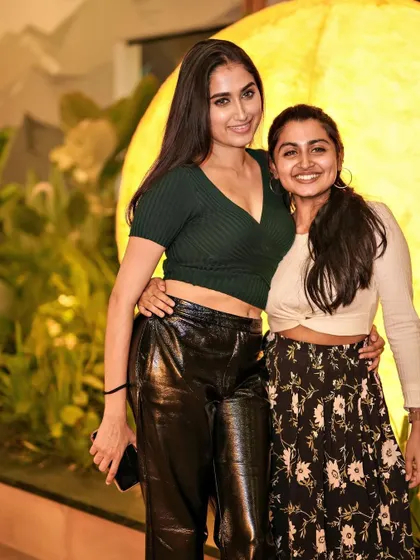 Two friends posing at Pangeo, another one of Bangalore's breathtaking rooftop spots where I love to play.