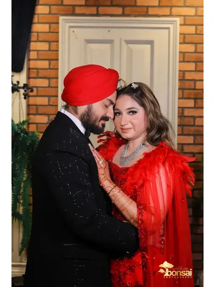 A romantic close-up of the couple, highlighting their connection and stylish outfits.