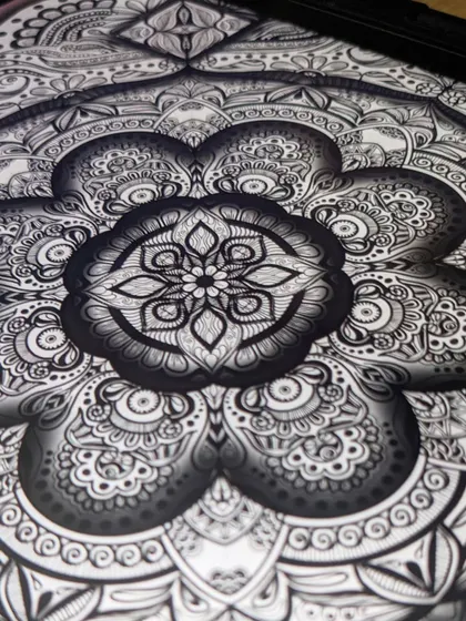 A close-up look at the heart of one of my mandala designs. I find so much joy in the details, creating patterns within patterns. This is where my passion for doodling really comes alive, filling spaces with intricate, meditative designs.