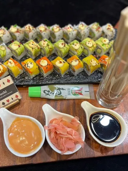 A beautiful platter of our vegetarian sushi, featuring a variety of colorful rolls. Served with soy sauce, wasabi, and pickled ginger, it's a fresh and healthy option for any party.
