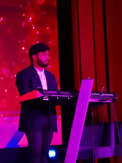 Our keyboardist focused on the music during our performance for the EliteCISOs Enterprise Security Summit at Taj Yeshwantpur.