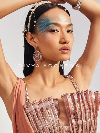 The unique shell-inspired 3D blouse of the Mira Saree Set. I love experimenting with new forms, and this pleated, embellished design creates a stunning visual impact.
