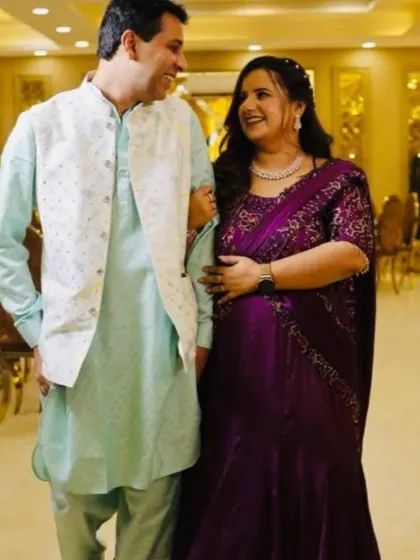 A candid moment of happiness. My client's smile shines as brightly as her custom purple draped gown, a perfect outfit for celebrating with loved ones.