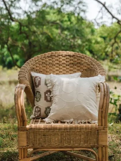 A simple wicker chair is instantly elevated with our vine-embroidered and floral-stamped cushion covers. It's an easy way to add a touch of handcrafted charm to your outdoor or indoor seating.
