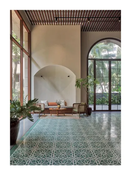 The lobby of the Artveda building in Pali Hill, Mumbai. We wanted to create a feeling of tranquility and spirituality right from the entrance. The high ceilings, arched niche, and beautiful patterned floor create a serene welcome.