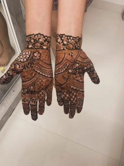 Amazing teamwork by my best artists, Kinjal and Pooja. This is a beautiful, full-hand design for a guest.
