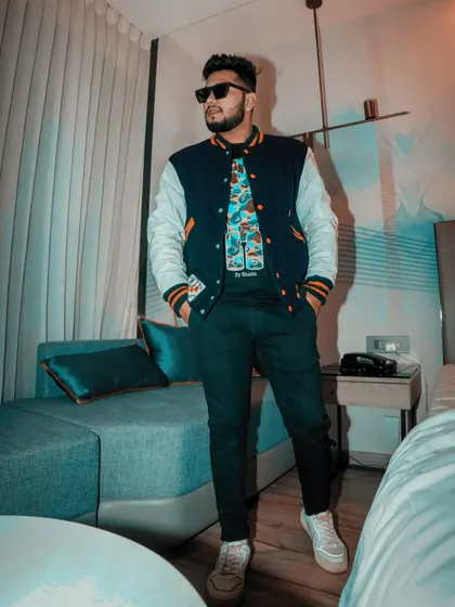 A confident stance before the show. Ready to bring the energy.