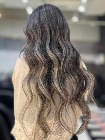 This ash balayage catches the light and all the compliments. The cool, smoky tones are blended perfectly for a sophisticated and modern style.