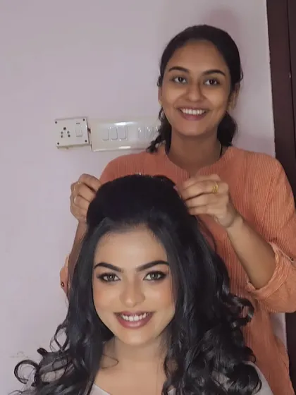 A behind-the-scenes shot of me creating a classic Christian wedding look. The hairstyle is a modern updo with soft curls, perfect for a gown.