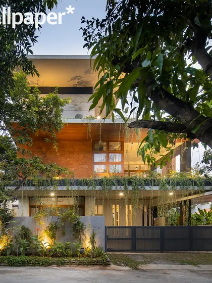 The house at dusk, as featured in Wallpaper*, where the lighting design accentuates its architectural form and landscape.